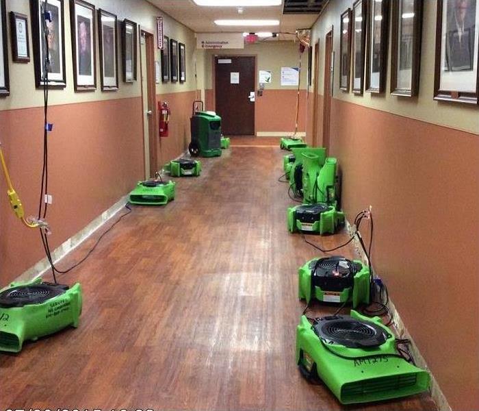 Air movers in a hall way